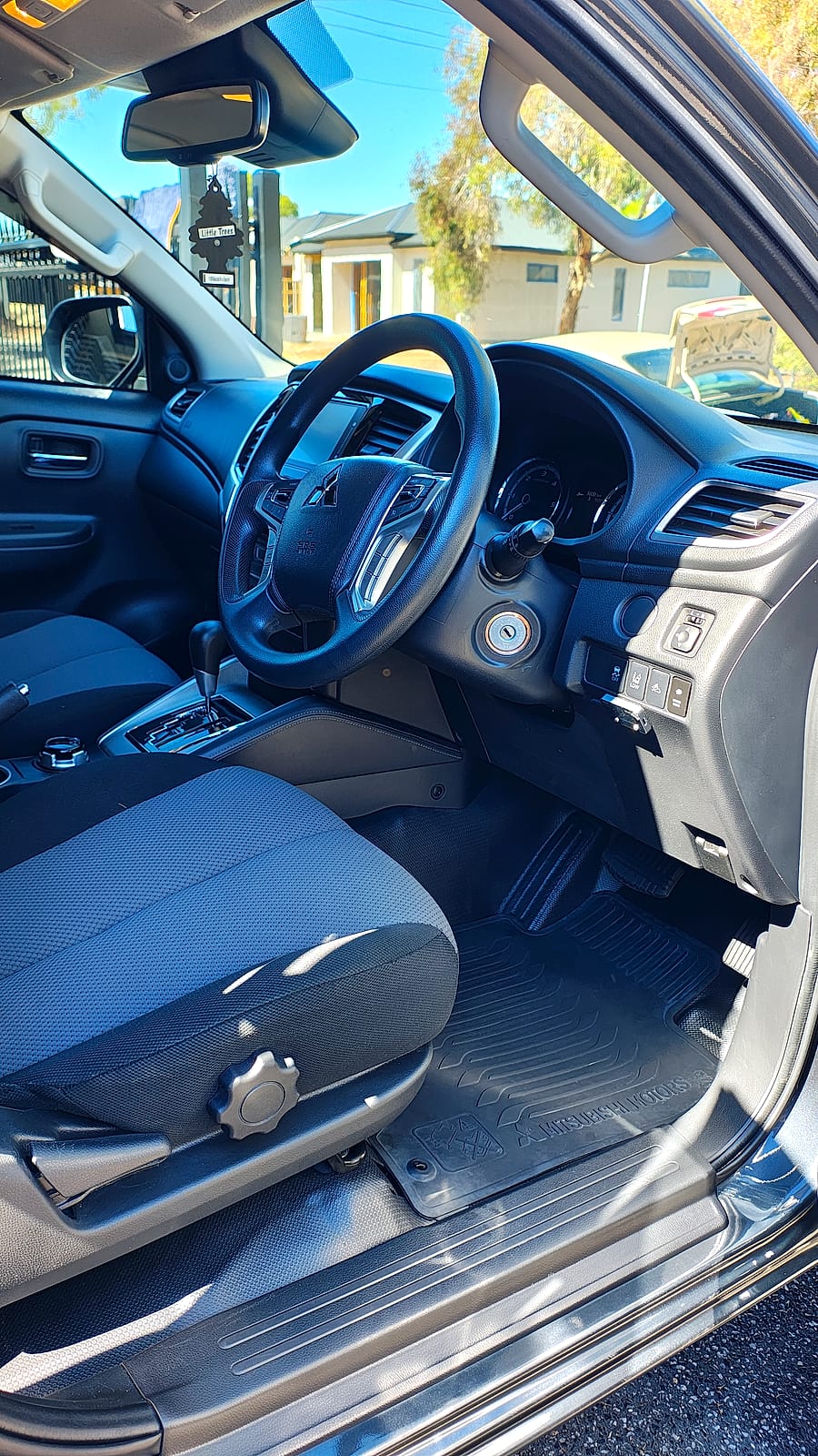 Freshly detailed car interior with clean steering wheel and dash