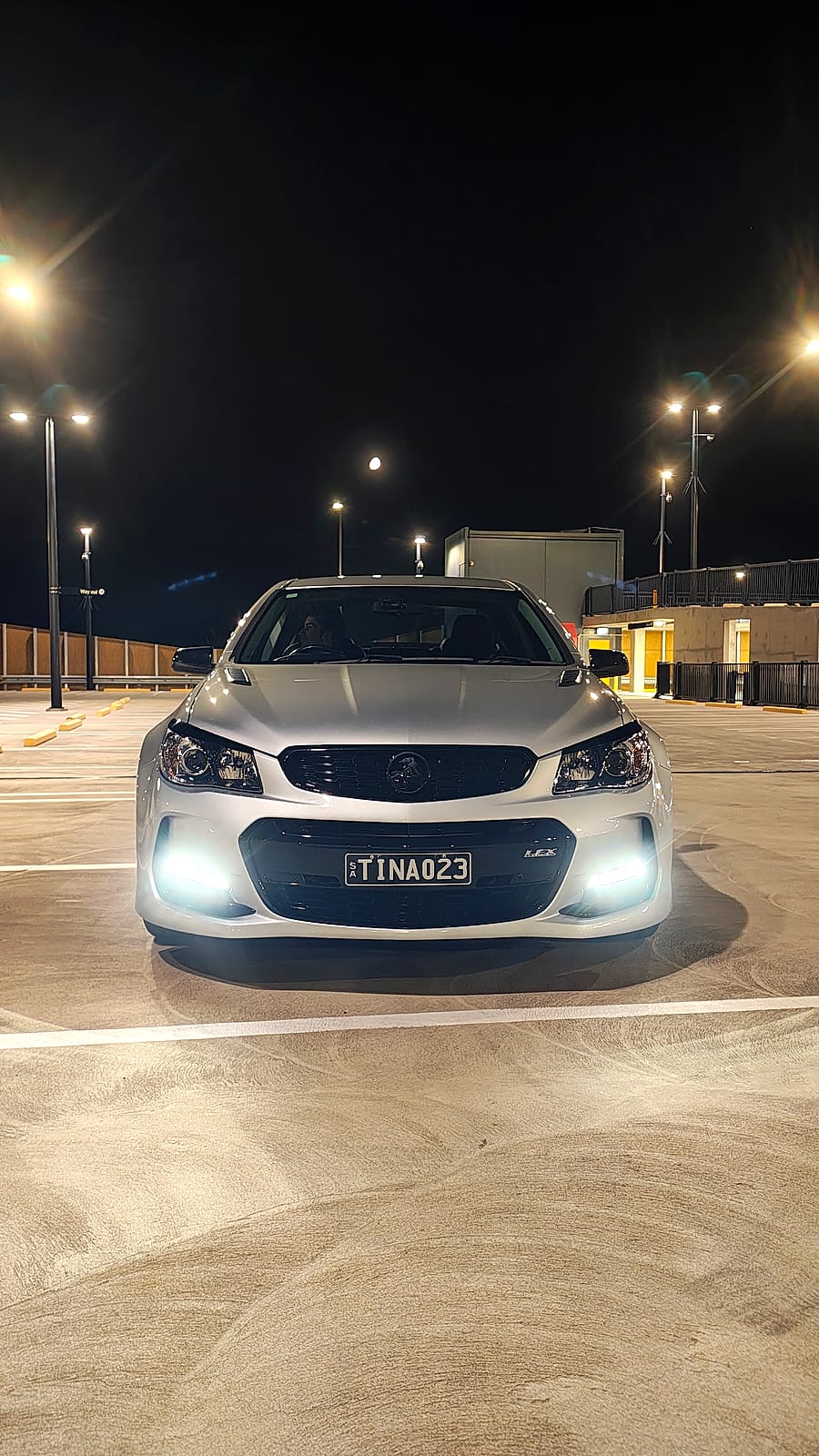 Holden SSV freshly detailed under lights at night